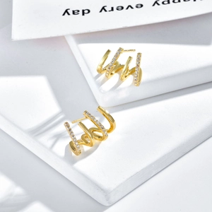Classic 14K gold plated four-prong earrings with sparkling pavé zircons in a pair