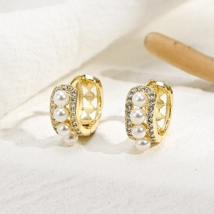 U-shaped 14K gold plated earrings with three pearls and micro-pave cubic zirconia accents