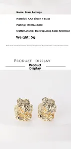 Macro detail of irregular pleated brass stud earrings with 14k gold plating and textures