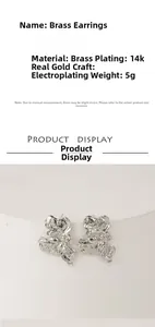 Detailed view of irregular brass stud earrings with silver metallic texture and 14k gold plating