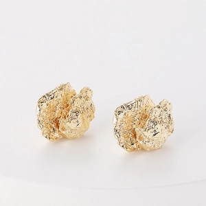 Modern minimalist gold plated brass earrings featuring a textured crumpled metal design