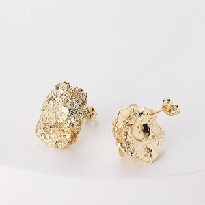 Irregular wrinkled gold earrings with unique textured finish in minimalist 18K style