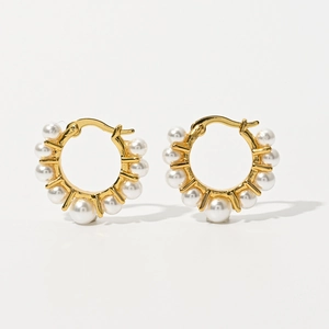 Detailed macro view of French vintage 14k gold plated earrings with freshwater pearls