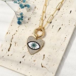 Paperclip chain necklace with zircon evil eye heart pendant in gold plated finish