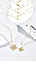Details der 14k Gold Schmetterlings- und Bienenanhänger mit Zirkonia und weißen Perlen