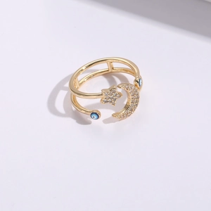 Golden double-layer open ring with star, moon, and blue evil eye charms set in zircon