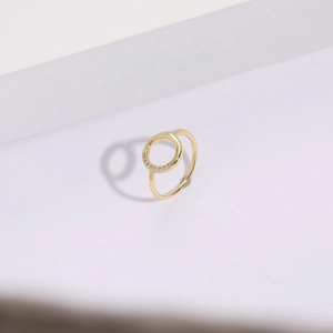 Detail showing 14k gold plated brass ring with circular design and cubic zirconia inlay
