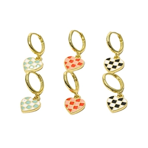 Checkerboard heart drop earrings in blue, orange, and black retro geometric style