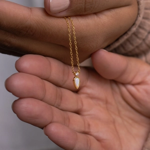 Elegant 14k gold plated teardrop necklace featuring white opal and zircon stone pendant