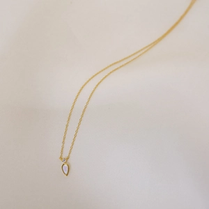 14k gold plated water drop necklace with iridescent opal and zircon pendant on silk background