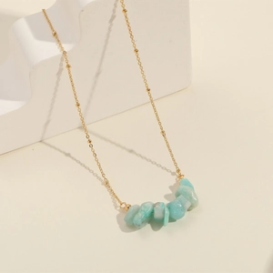 Elegant 14k gold plated necklace featuring natural light blue stone pendant on beaded chain