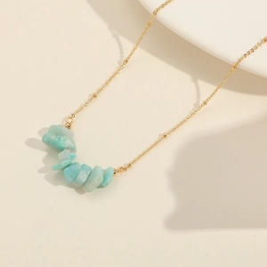 Bohemian gold plated necklace featuring natural light blue stones and decorative beads