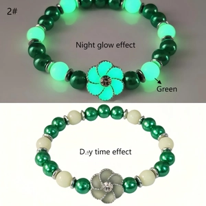 Luminous sunflower bracelet showing the contrast between day and night glow effects