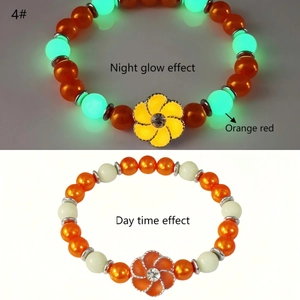 Macro shot of luminous orange sunflower bracelet showing daylight and night glow effect