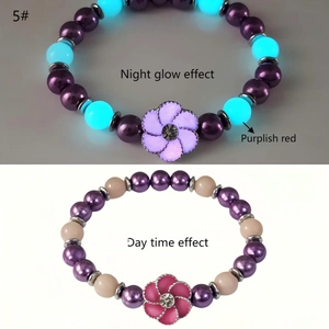 Luminous beaded bracelet with purple flower pendant showing day and night glow effect contrast