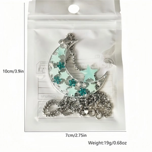 Luminous moon and star pendant size guide in package with 10cm by 7cm dimensions