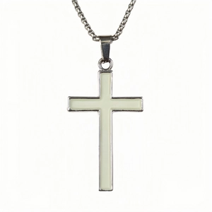Close-up of a silver cross pendant with glowing blue inlay and a classic O-link chain