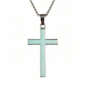 Detailed macro view of luminous cross pendant with silver metal frame and box chain