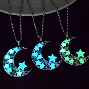 Luminous crescent moon and star pendant necklaces with glowing night sky effect