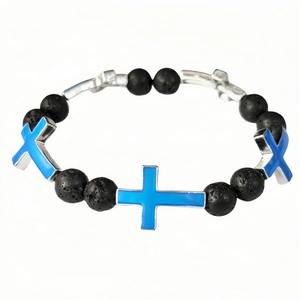 Detailed shot of black lava stone beaded bracelet featuring blue luminous metal crosses