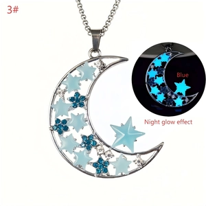 Detailed view of luminous crescent moon and blue star pendant with glowing effect
