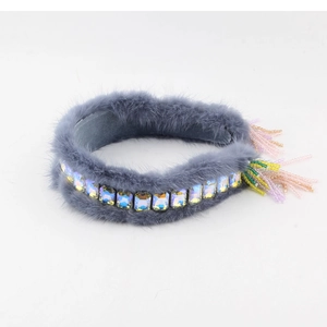 Luxury grey faux fur headband featuring square crystals and colorful beaded tassels