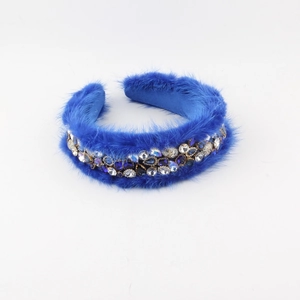 Royal blue faux fur headband with luxury rhinestones and sparkling crystals on white background