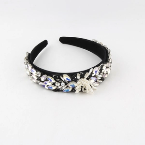 Detailed close-up of Baroque headband featuring intricate rhinestones and white pearls
