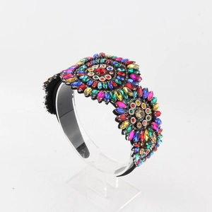 Macro view of crystal baroque wide headband with colorful floral rhinestone details