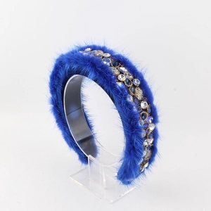 Detail of royal blue rhinestone headband with fluffy faux fur for elegant winter styling