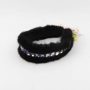 Detail of mink fur headband with square crystals and colorful beaded tassel charms