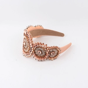 Elegant Baroque crystal and pearl headband with rose gold floral rhinestones on white background