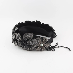 Detail of velvet headband with crystal flowers and black beaded tassel pendant