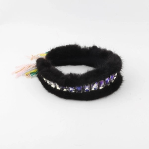 Close-up of black mink fur headband with purple square rhinestones and colorful beaded tassels