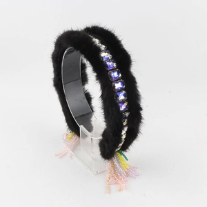 Detail view of black faux mink fur headband with square crystals and colorful beaded tassels