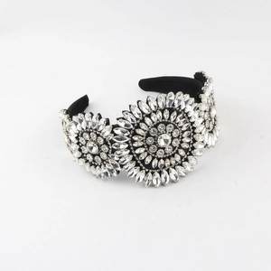 Detail of luxurious Baroque headband with sparkling crystals on black velvet base