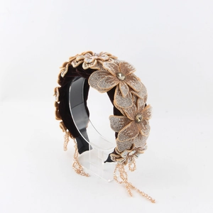 Detail of velvet baroque headband with crystal flower and hanging fringe tassels