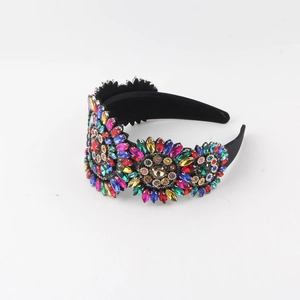 Macro shot of colorful rhinestones floral pattern on a wide baroque headband