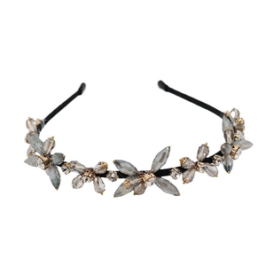 Elegant woven headband with five smoky grey crystal flowers and sparkling diamond centers