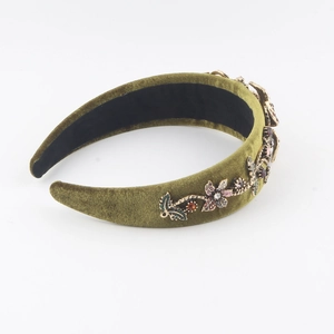 Detail of baroque olive green velvet headband with colorful floral crystal embellishments
