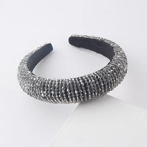 Close-up of padded headband with grey faceted crystals and black velvet lining