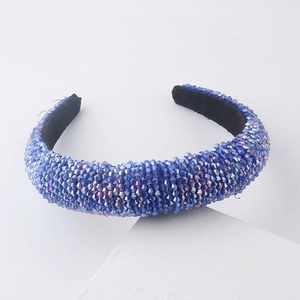 Detail of blue crystal beaded wide headband with high-density faceted rhinestones and velvet