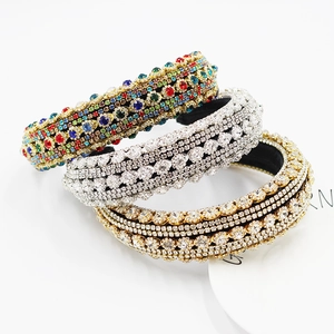 Detailed macro view of three baroque style headbands with luxury colorful rhinestones