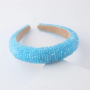 Macro detail of padded light blue headband with iridescent crystals and non-slip lining