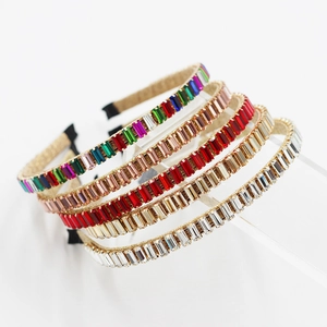Detail of five baroque headbands with baguette-cut crystals and gold metal frames