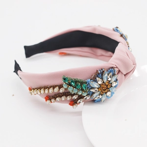 Detail of pink baroque headband with floral embroidery and crystal bead embellishments
