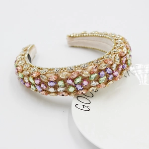 Detail of baroque headband with luxury champagne fabric and colorful crystals