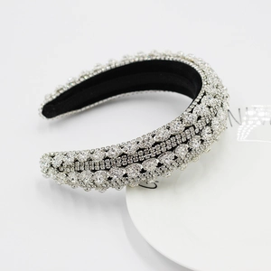 Detail shot of heavy baroque headband with silver rhinestones on black velvet lining