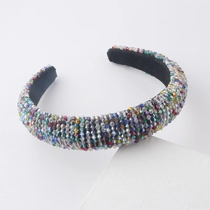 Detail of colorful crystal beaded sponge headband with retro style and thick velvet base