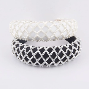 Detail of sponge padded headbands with elegant pearl mesh in black and white colors